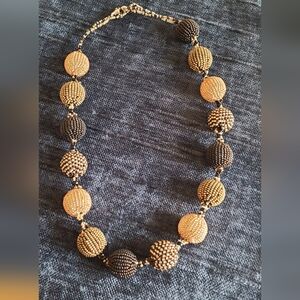 Beautiful hand beaded 21inch necklace gold,black,bronze toned beads.